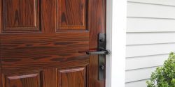 Mahogany front door with black hardware.